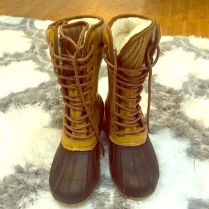 Mid calf, fur lined winter waterproof duck boots.